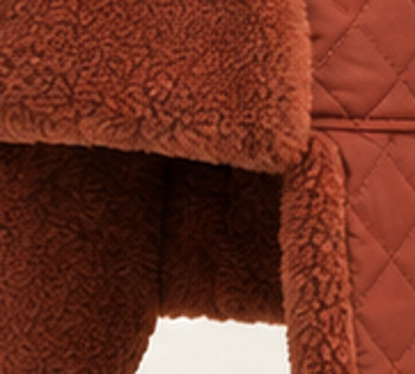 Iskra Quilted Trapper, close-up of Rust material and trim